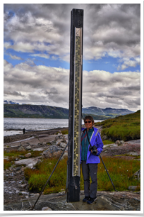 Marilynn next to the snow gauge by the lake.